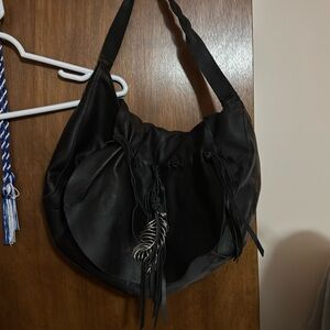 Lucky Brand leather bag with feather accent charm